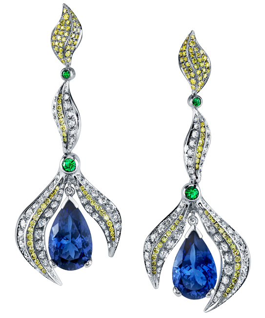 MJSA American Vision Award 2013 - 1st Place, Platinum Distinction Platinum earrings featuring two pear shaped tanzanites totaling 9.36ctw, accented with 0.28ctw of green tsavorite garnets, 0.954ctw of yellow diamonds, and 1.88ctw of white diamonds. This piece is available for reproduction. Contact us to find out more.