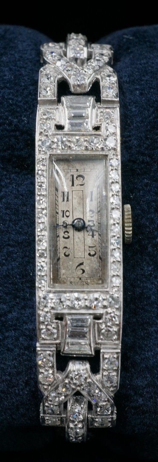 Watch: Edwardian era Rado brand 17 jewel mechanical movement watch with black cord band, fastening with a fold-over locking clasp | 68 diamonds | 1.32 carats | Appraisal: $19,950