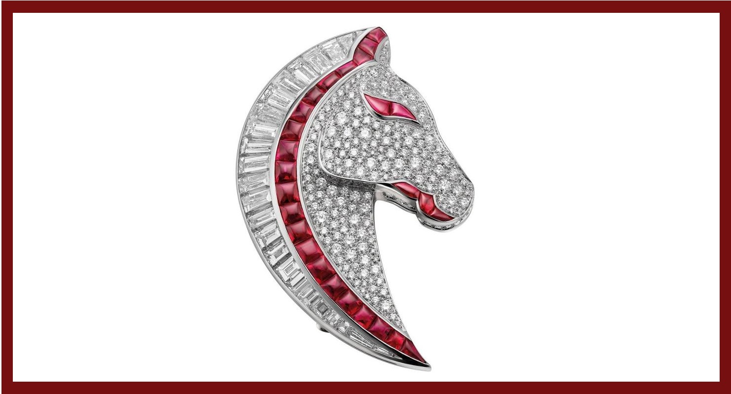 This horse head brooch is made with 18k white gold with 26 rubies, 24 trapezoidal step diamonds and diamond pavé