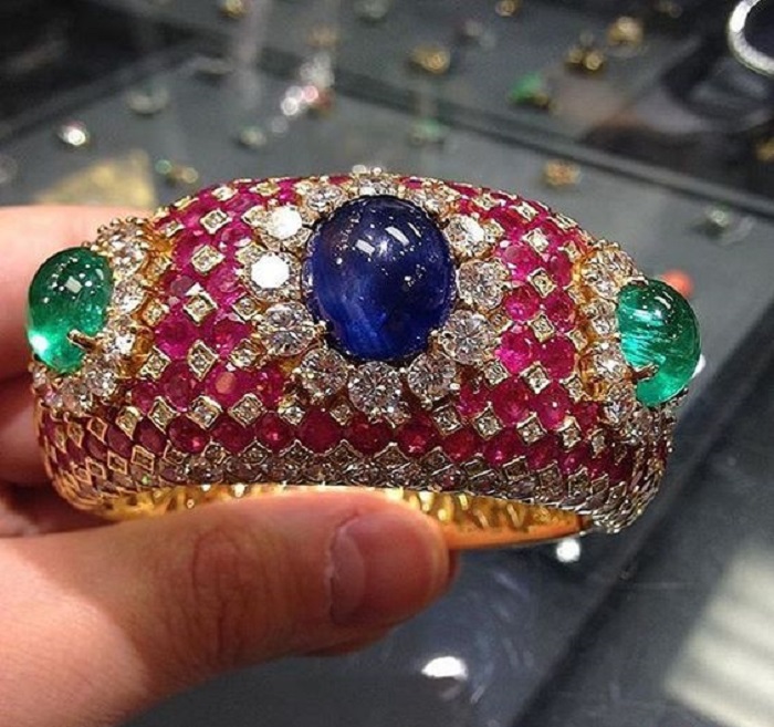  Sapphires and rubies and emeralds and diamonds come together as one spectacular bracelet.