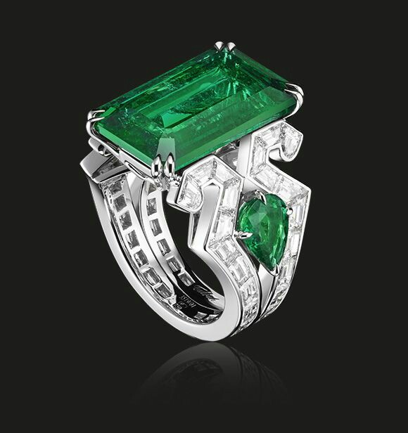 This stunning Columbian emerald is set in a white gold Art Deco style ring, shouldered by baguette diamonds and two pear shaped emeralds. A magnificent example of the House of Tabbah’s craftsmanship and stones’ expertise.    Rectangular shaped emerald 10.70 cts