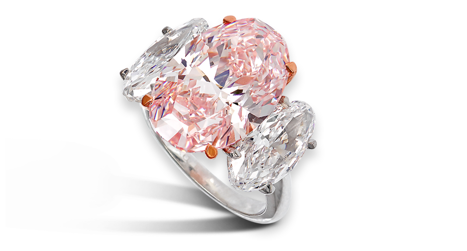 Important fancy intense pink oval diamond ring with marquise white diamond shoulder stones set in platinum Total weight 14.09ct by David Morris The London Jeweller