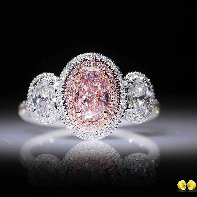A pink diamond like no other, set in a delicate oval shaped halo with white oval cut diamonds to bring out that rare beautiful pink diamond even more! 