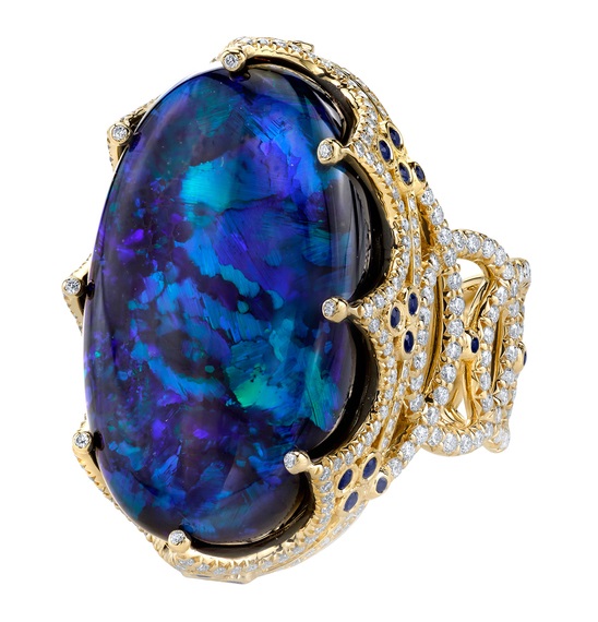 ROYAL RING 18K Yellow Gold ring featuring a 26.11 ct. Black Opal, .58 ctw. of Blue Sapphires, and 2.23 ctw. of Diamonds.