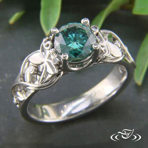 Classic Garden vine ring Green diamond center and flowers cast into place on each side of center stone, (6) bezel set round diamond (3 on each side) with hand fabricated vine work