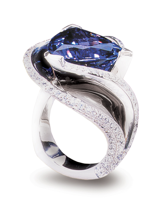 Smithsonian Institution, Washington DC - On Pernanent display at the National Museum of Natural History AGTA Spectrum Award 2001 – Platinum Guild International - Platinum Honors, Division 1 Platinum ring featuring a 12.11ct tanzanite, accented with 1.89ctw of white diamonds. This piece is available for reproduction. Contact us to find out more.