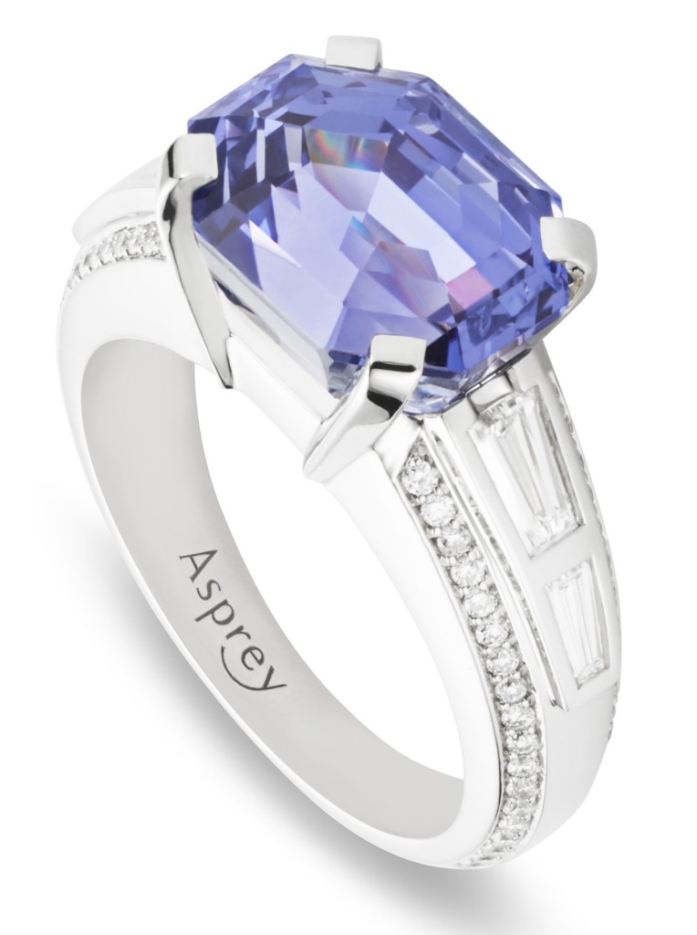 Violet sapphire surrounded by diamonds, set in platinum ring