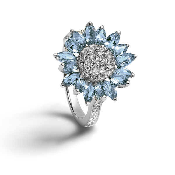 Individually set with marquise cut aquamarine petals with a pavé diamond centre, all set in 18ct white gold.