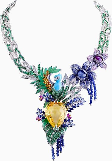 One-of-a-kind Van Cleef Arpels “Splendeur Africaine” necklace featuring a 82.68-carat pear-shaped yellow sapphire, multi-color sapphires, emeralds, diamonds, chrysoprase and turquoise set in 18K white gold! 