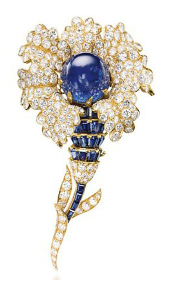 A SAPPHIRE AND DIAMOND BROOCH, BY VAN CLEEF & ARPELS. Designed as a flower, centering upon a cabochon sapphire, within pavé-set diamond petals, to the calibré-cut sapphire and brilliant-cut diamond stem, mounted in gold, 1965, 9.8 cm Signed Van Cleef & Arpels, no. N.Y. 36070 