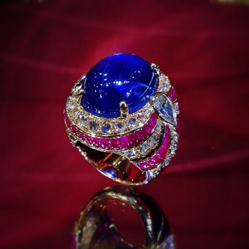 Unheated Burmese Star Sapphire ring in rose gold with fancy diamonds and Ruby cabs to add color. 