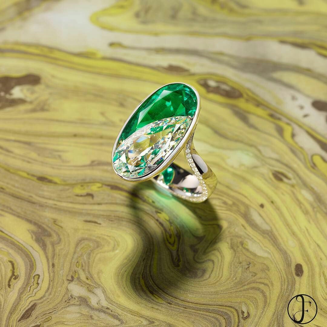 Two pear shaped gems are seamlessly set in this diamond and emerald ring creating the illusion of a perfect oval. The pear shaped Colombian no oil emerald weighs over 4 carats and is nestled against a three and half carat pear-shaped diamond. 